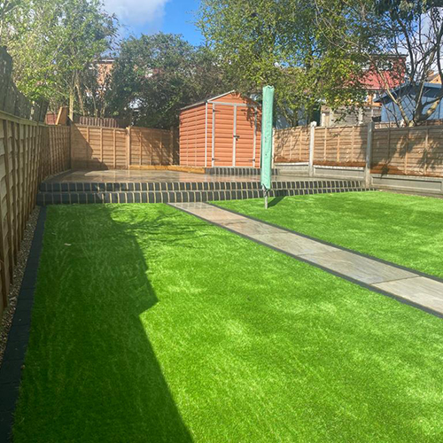 artificial grass, Indian sandstone patio and pathway, landscaping Essex