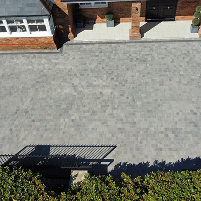 Driveway complete using Pencil Edge Block Paving in 3 sizes, with a charcoal boarder. Essex