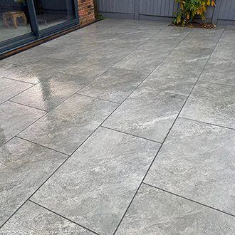 Patio with natural sandstone in havering