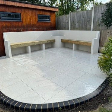 White porcelain patio with edging, seating and rendered to match. Romford Essex