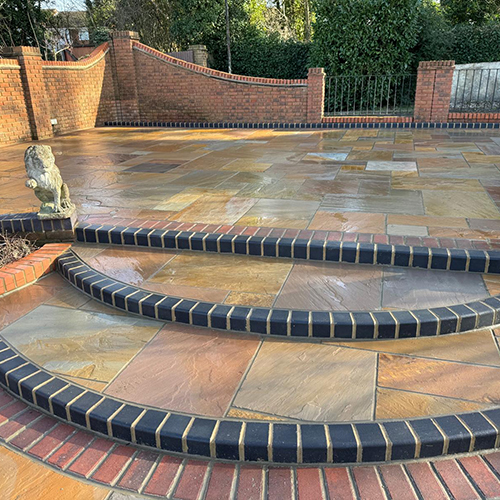 Indian sandstone patio with block paving edging, installed in romford, essex